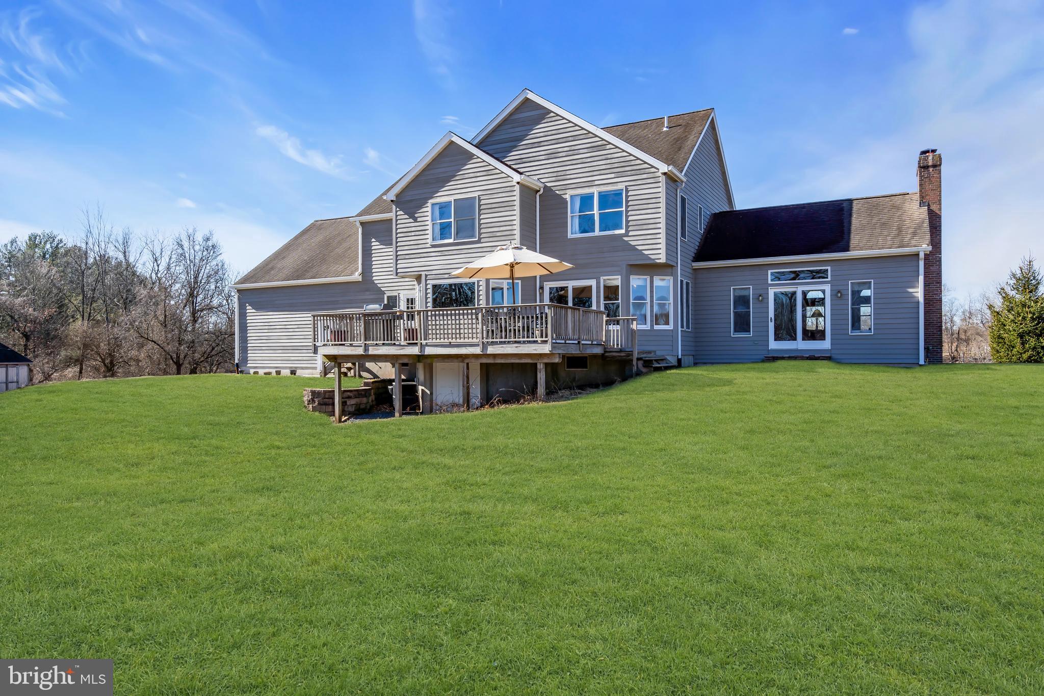 309 Pennington Harbourton Road Pennington, NJ 08534 - Photo 42 of 67 a front view of a house with a yard and trees