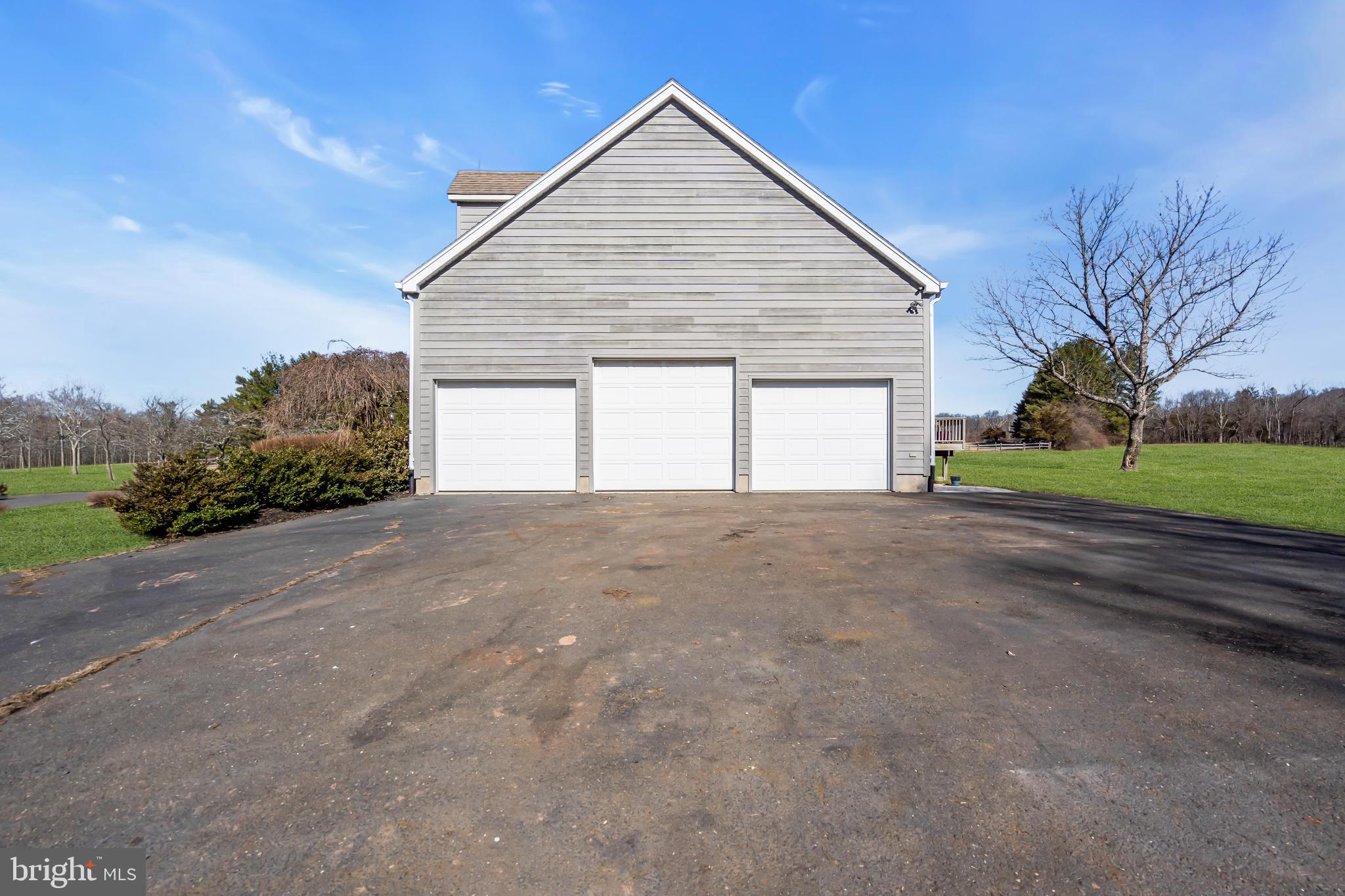 309 Pennington Harbourton Road Pennington, NJ 08534 - Photo 47 of 67 a view of a house with a yard and garage