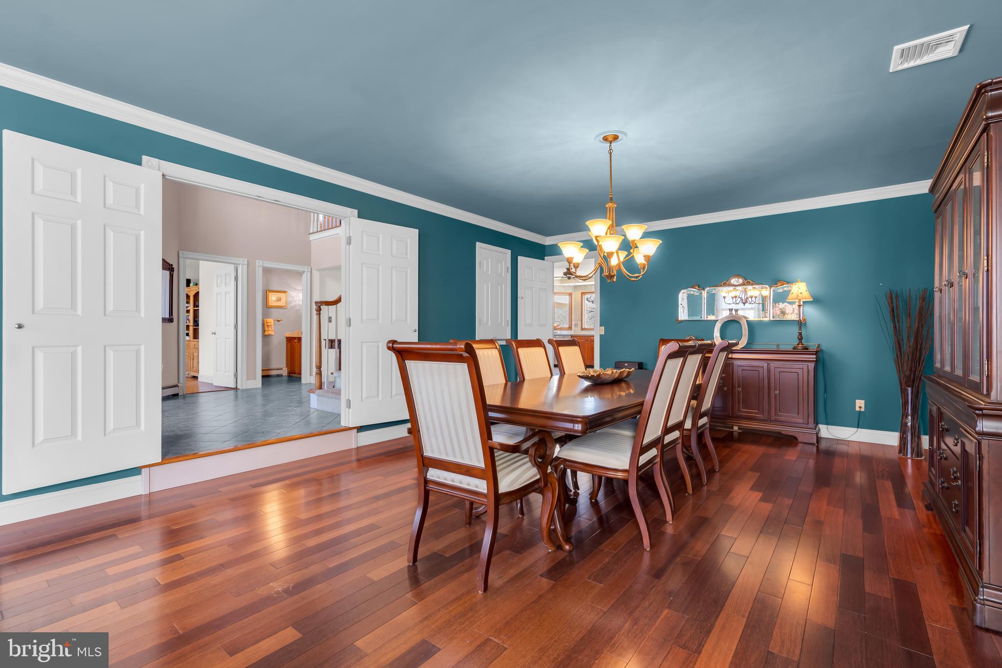 309 Pennington Harbourton Road Pennington, NJ 08534 - Photo 5 of 67 a dining room with furniture a chandelier and wooden floor