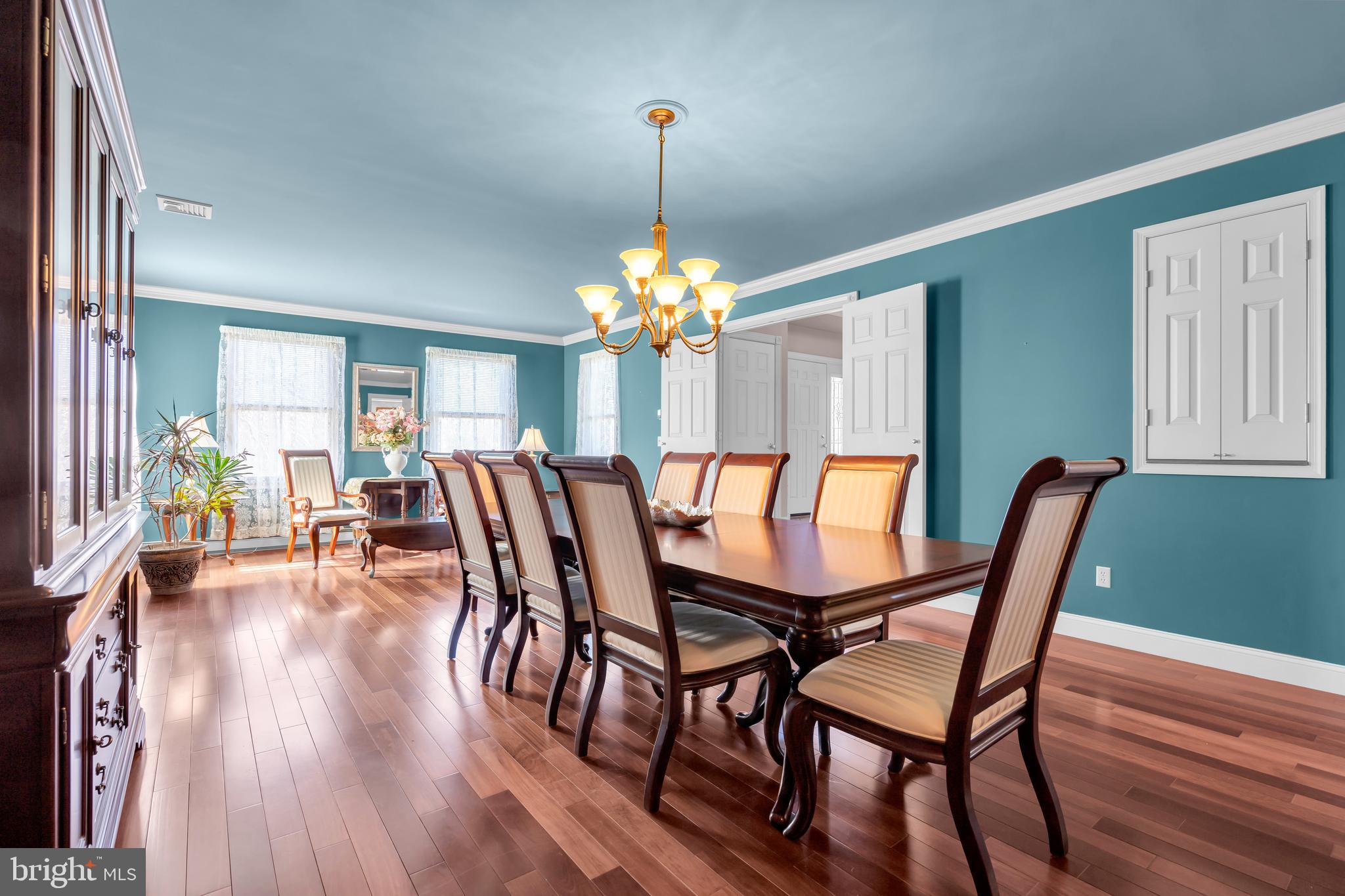 309 Pennington Harbourton Road Pennington, NJ 08534 - Photo 7 of 67 a dining room with furniture potted plants and wooden floor