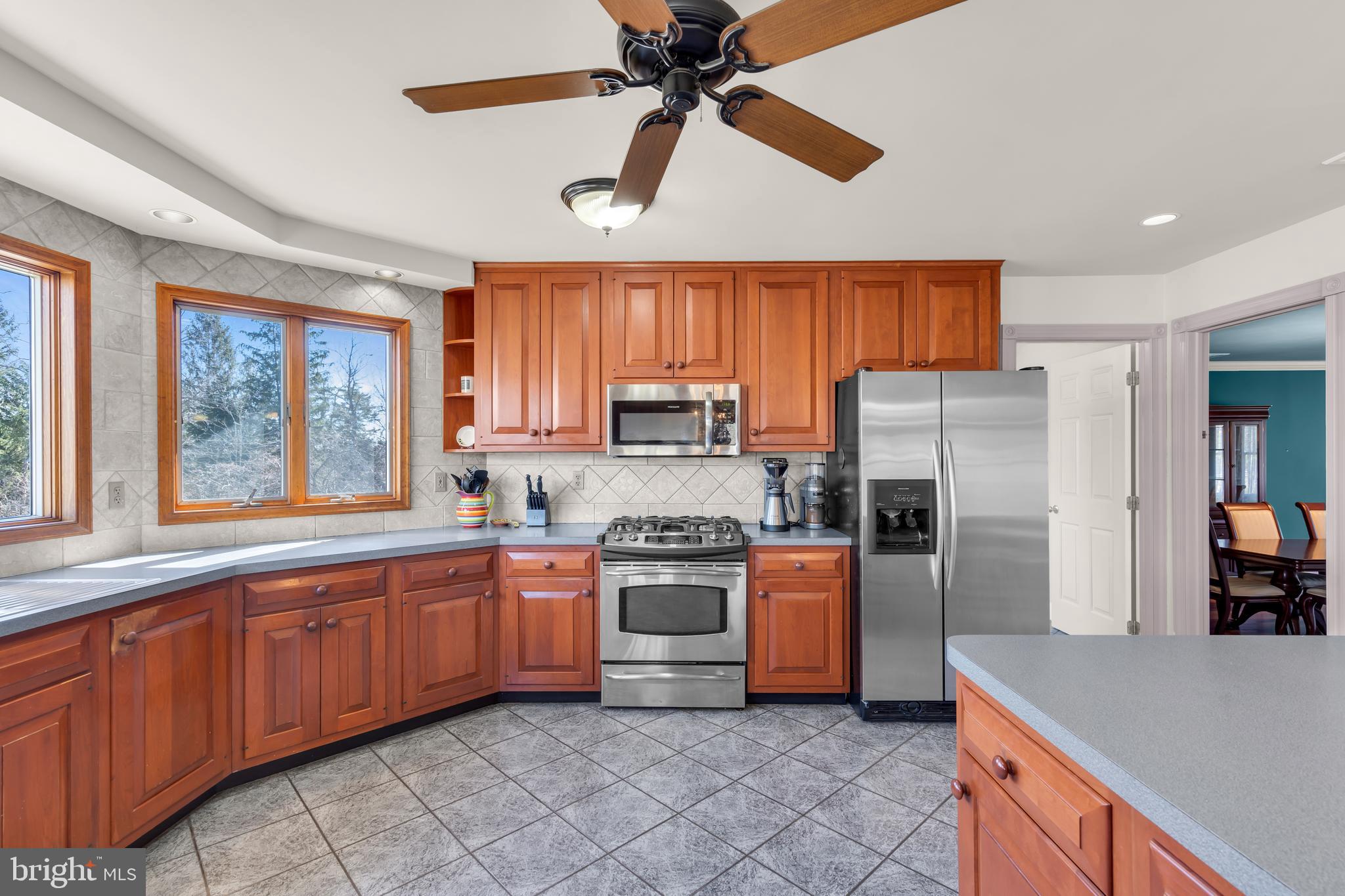 309 Pennington Harbourton Road Pennington, NJ 08534 - Photo 9 of 67 a kitchen with stainless steel appliances a refrigerator sink and microwave