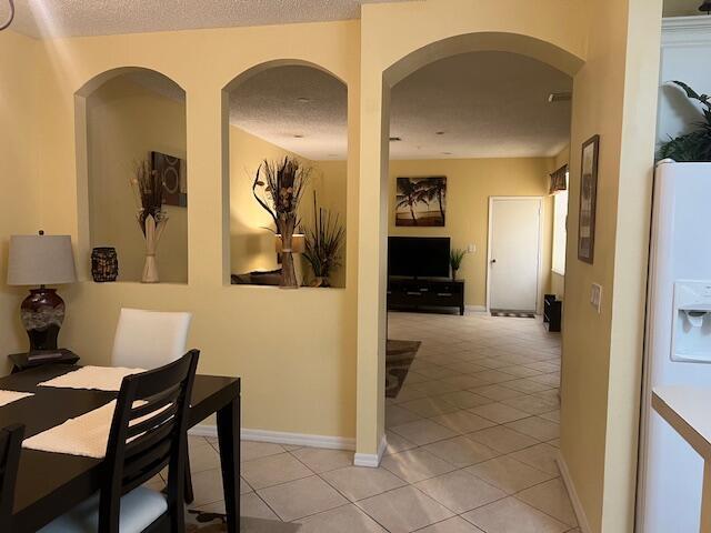 106 Lighthouse Circle, Unit G Tequesta, FL 33469 - Photo 16 of 34 a view of a livingroom with furniture and front door