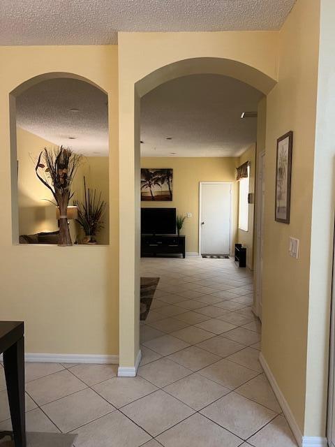 106 Lighthouse Circle, Unit G Tequesta, FL 33469 - Photo 17 of 34 a view of a hallway view with wooden floor and furniture