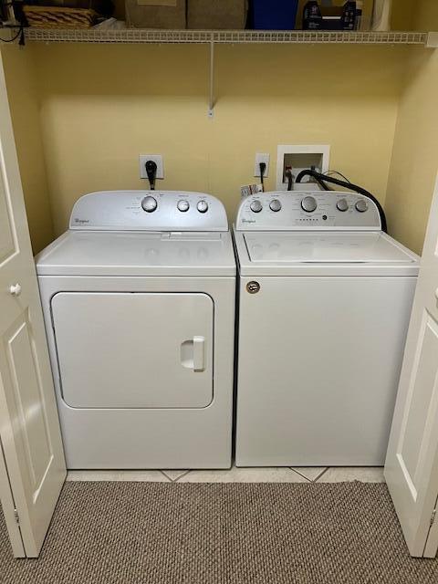 106 Lighthouse Circle, Unit G Tequesta, FL 33469 - Photo 20 of 34 a utility room with dryer and washer