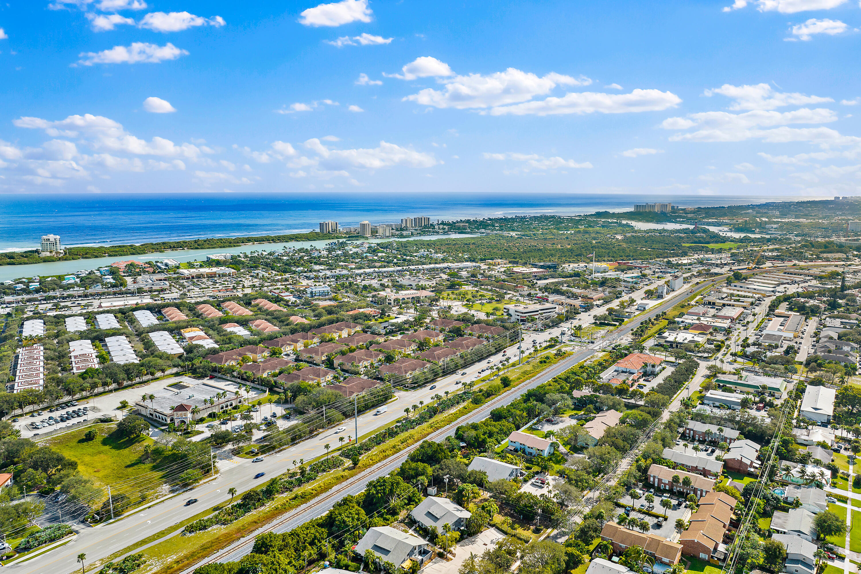 106 Lighthouse Circle, Unit G Tequesta, FL 33469 - Photo 6 of 34 an aerial view of city and lake
