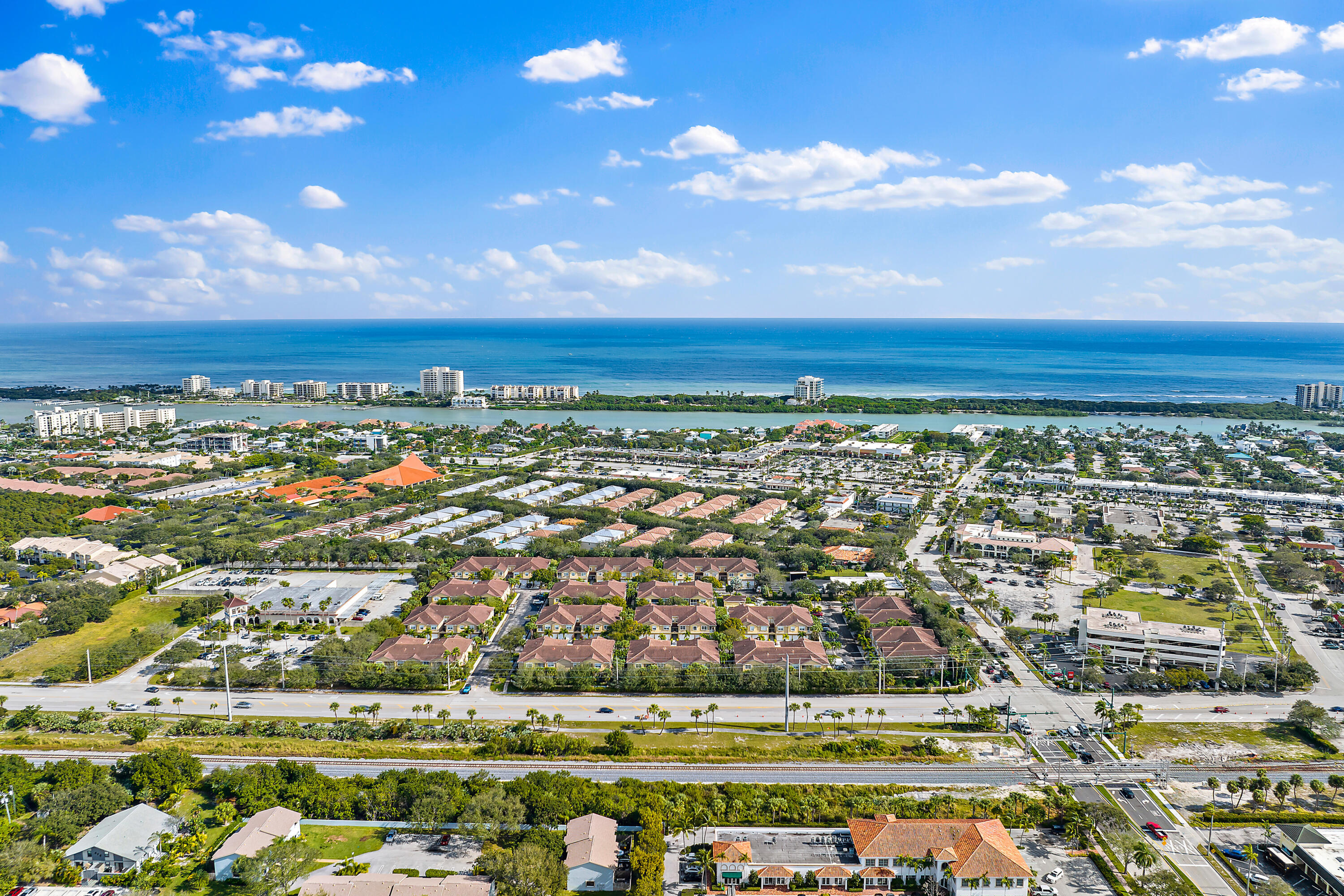 106 Lighthouse Circle, Unit G Tequesta, FL 33469 - Photo 8 of 34 a view of a city with lots of residential buildings and ocean view