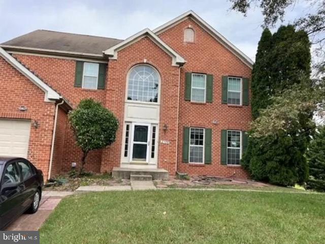 Charming brick home with elegant entrance.