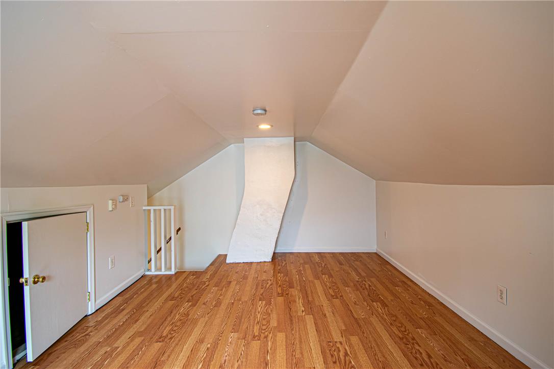 27 West Allen Street Allentown, PA 18102 - Photo 22 of 26 A versatile loft space, bathed in natural light, features rich wood flooring and a distinctive architectural accent.