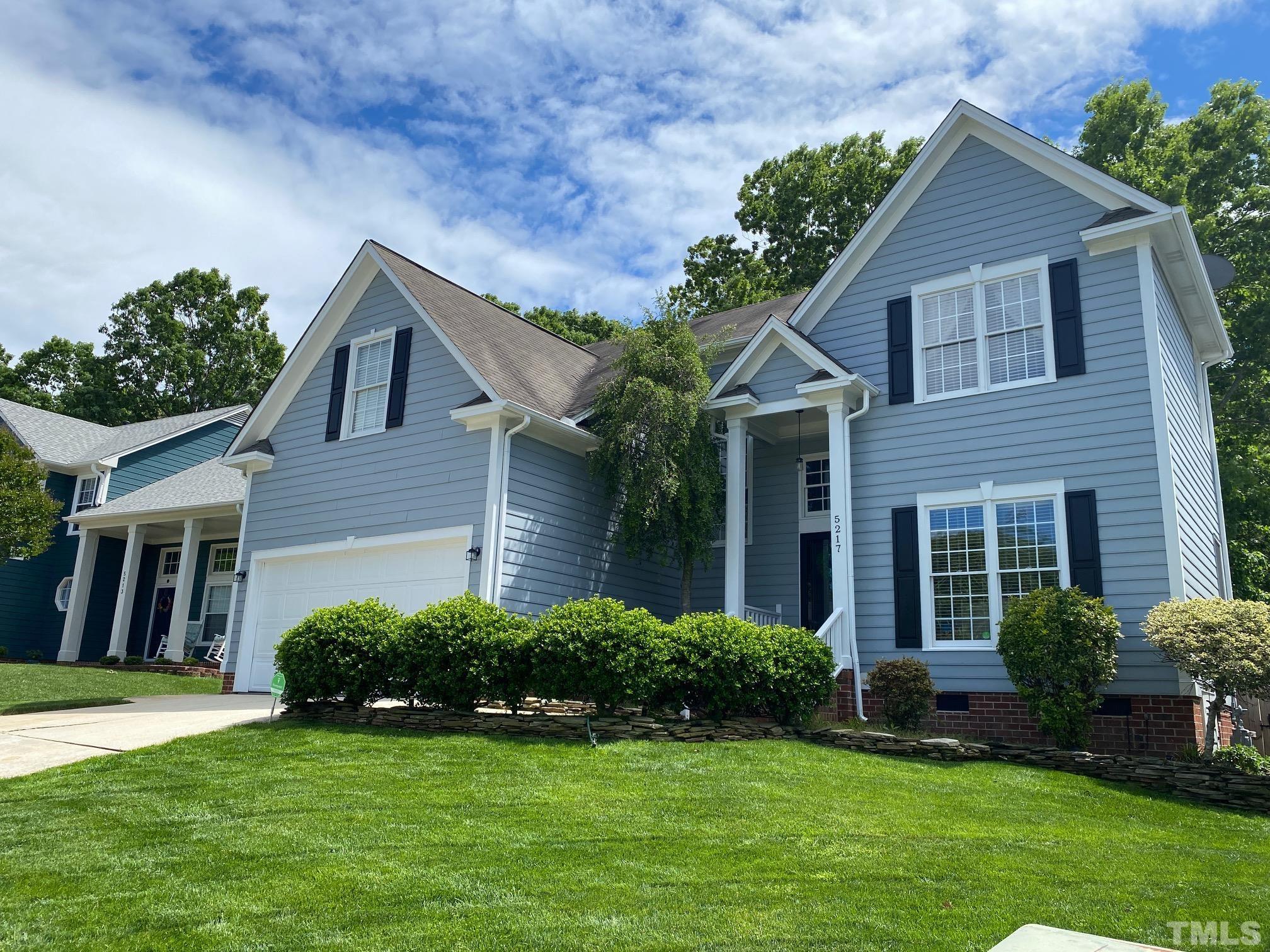 5217 Denmead Way Raleigh, NC 27613 - Photo 1 of 30 a front view of a house with a yard