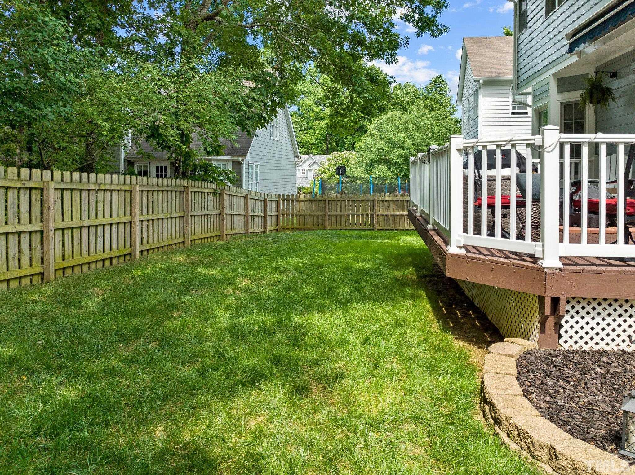 5217 Denmead Way Raleigh, NC 27613 - Photo 6 of 30 a view of a deck with a chair