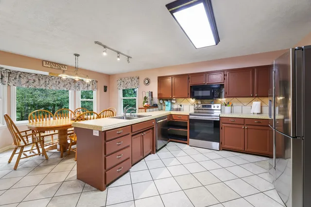 a bed room with a bed and wooden floor