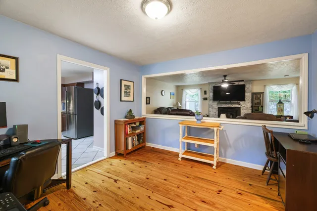 a view of a dining room with furniture window and outside view