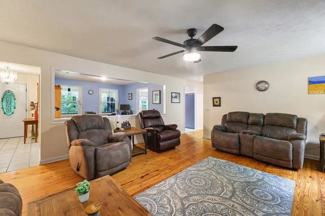 a bathroom with a double vanity sink a mirror and a bathtub