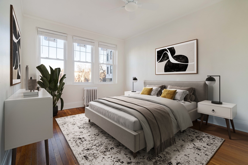 321 Tappan Street, Unit 1 Brookline, MA 02445 - Photo 10 of 19 a bedroom with a large bed and a window