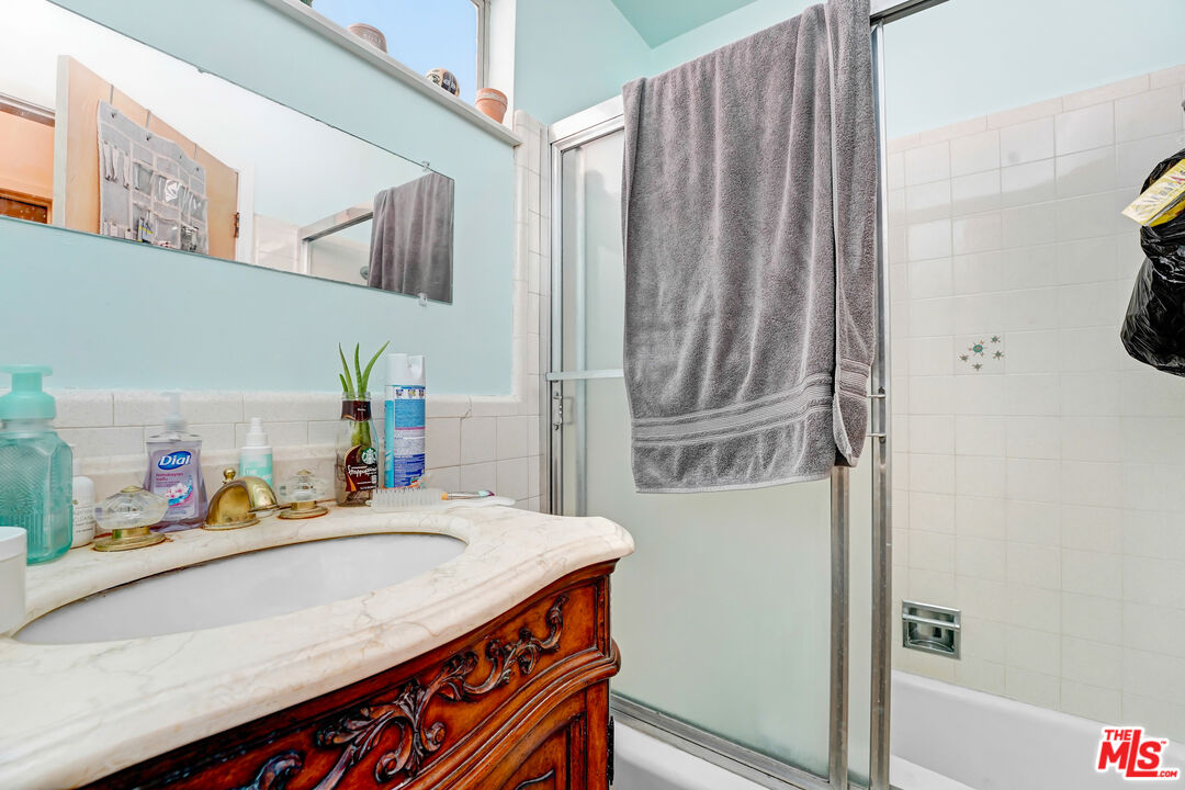6424 Shenandoah Avenue Los Angeles, CA 90056 - Photo 23 of 35 a bathroom with a sink and a mirror