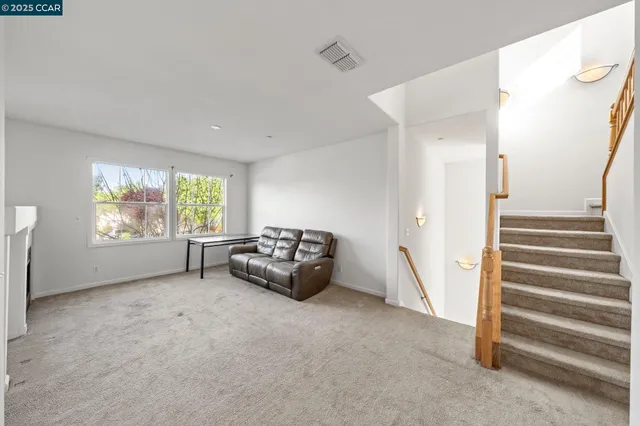 a view of livingroom with furniture and windows
