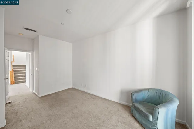 a room with a chair and couch