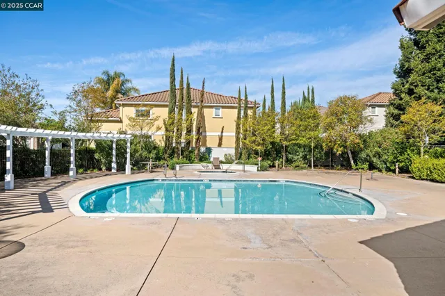 a view of a swimming pool with a patio