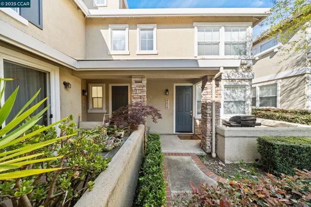 a front view of a house with a porch