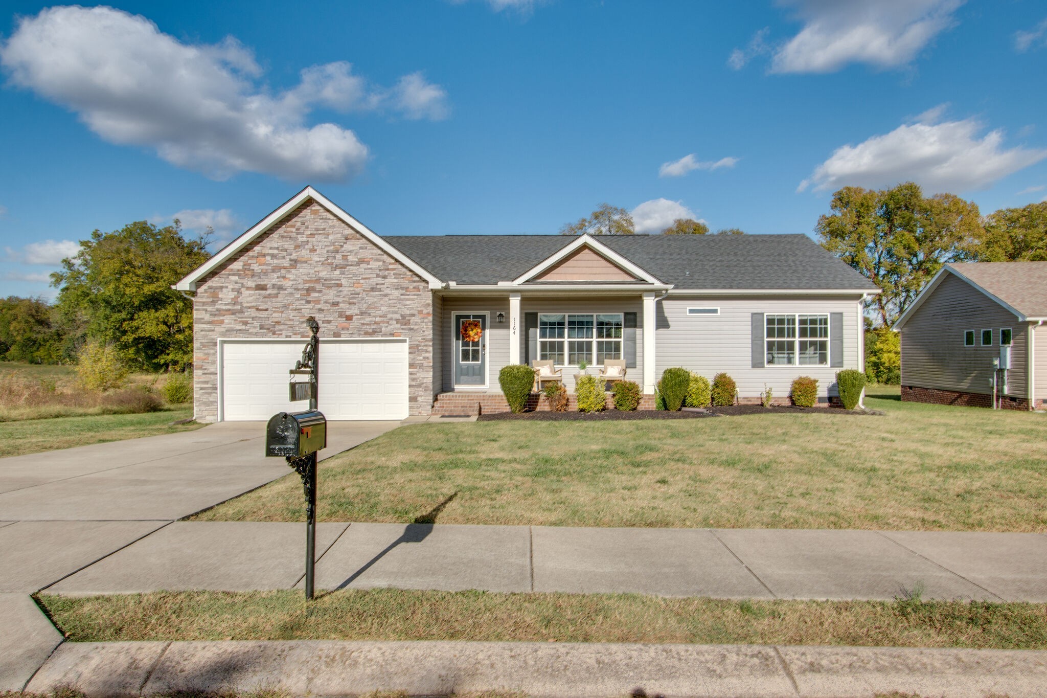 1164 Wrights Mill Road Spring Hill, TN 37174 - Photo 1 of 30 a front view of a house with garden