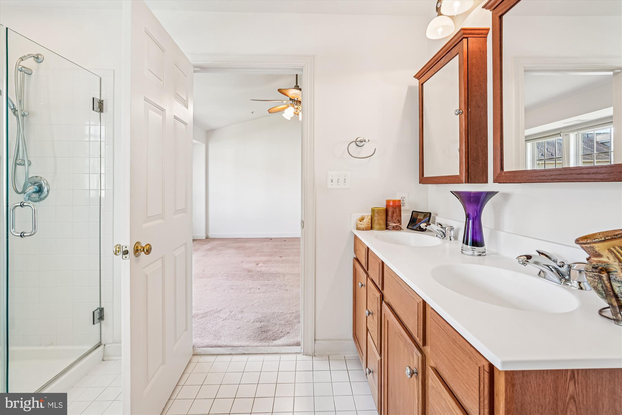 142 Swanton Lane Gaithersburg, MD 20878 - Photo 35 of 68 a bathroom with a sink vanity granite tub shower and a mirror