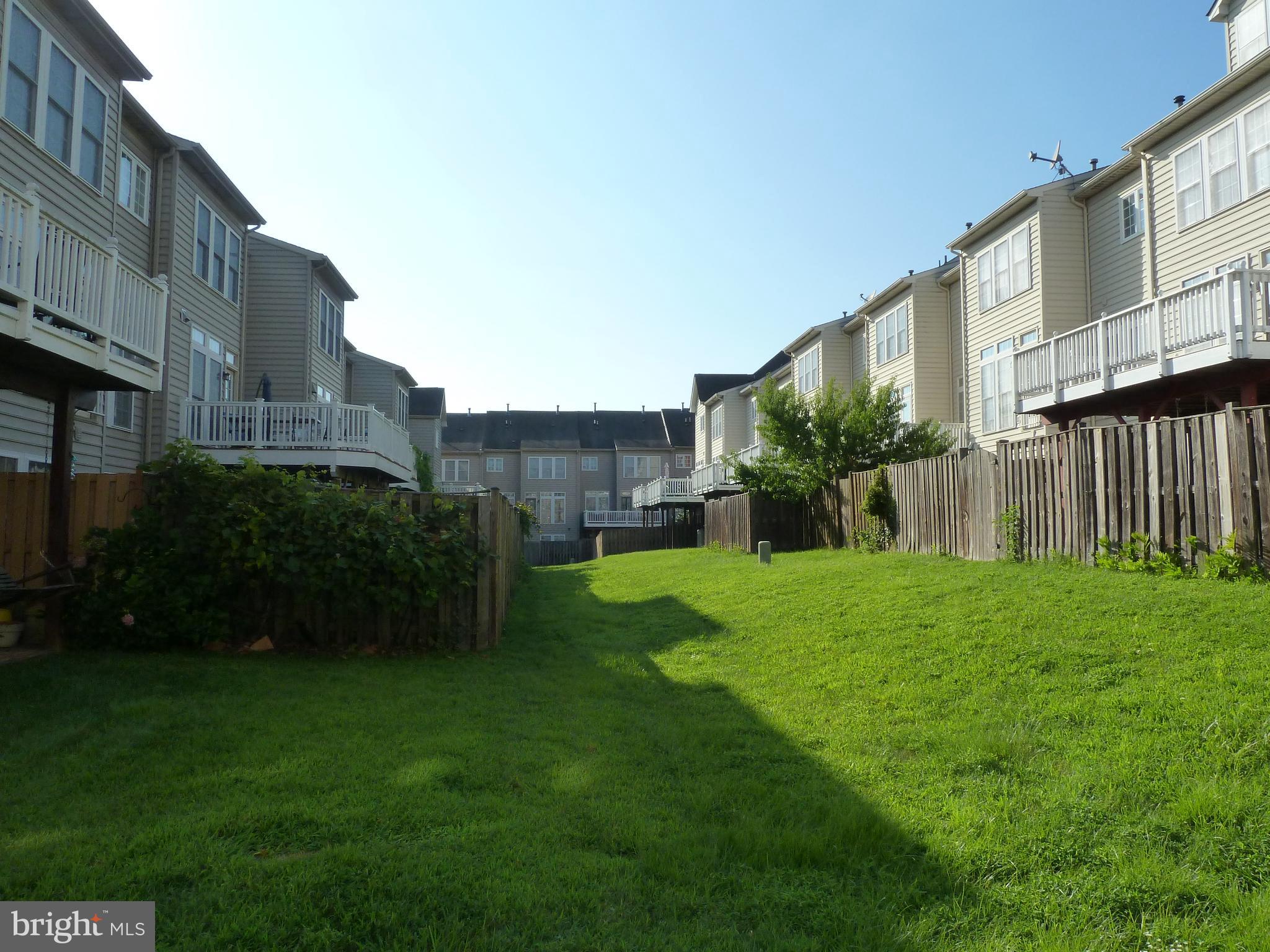 142 Swanton Lane Gaithersburg, MD 20878 - Photo 47 of 68 a view of a house with backyard and a garden