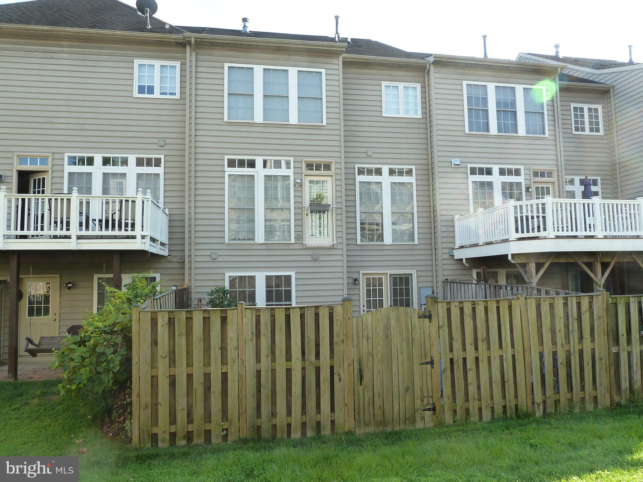 142 Swanton Lane Gaithersburg, MD 20878 - Photo 6 of 68 a view of a house with a backyard