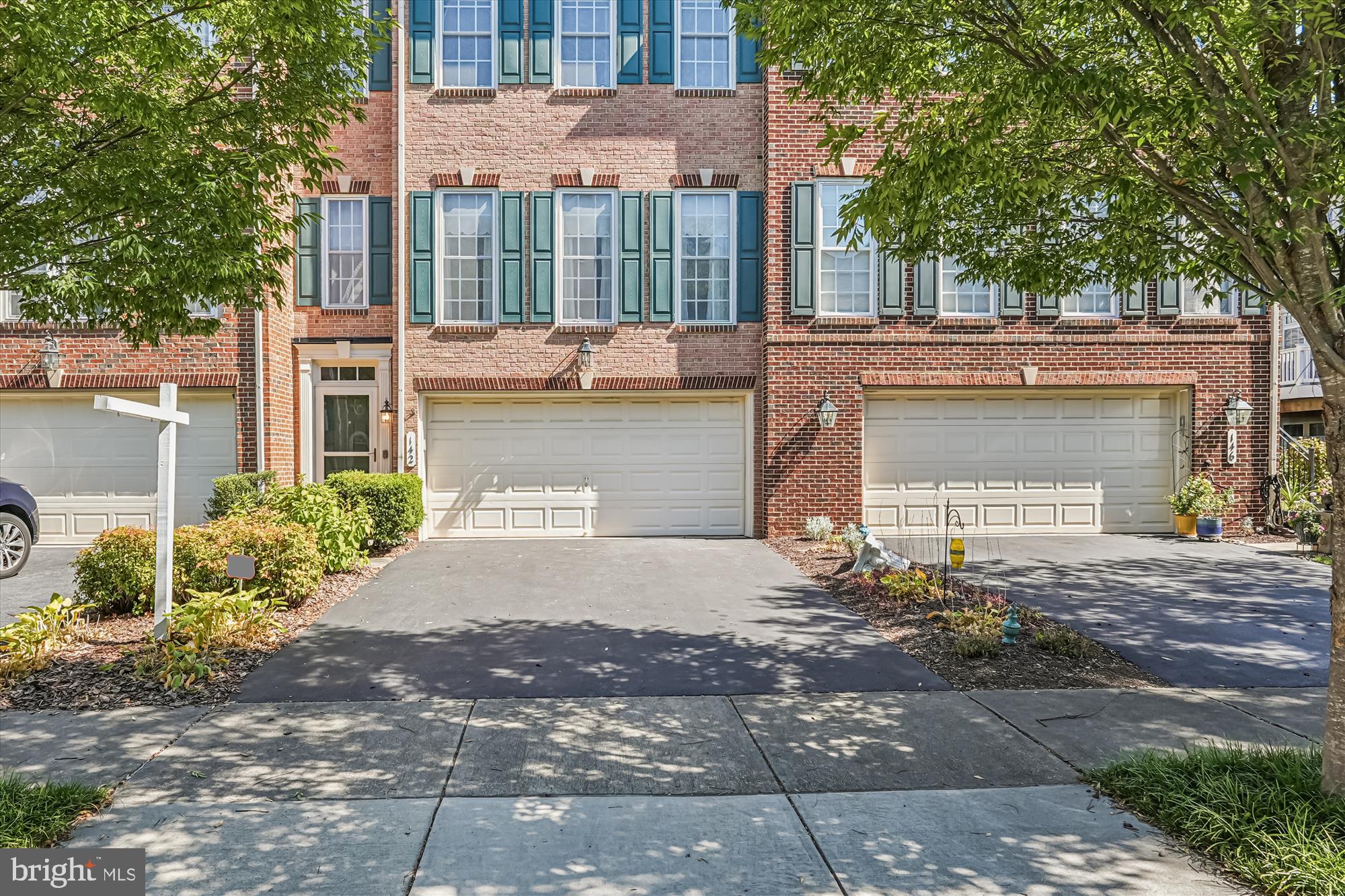 142 Swanton Lane Gaithersburg, MD 20878 - Photo 68 of 68 a front view of a house with a yard and a garage