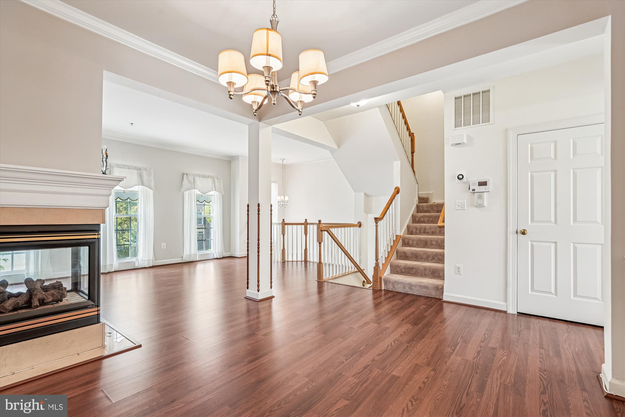 142 Swanton Lane Gaithersburg, MD 20878 - Photo 8 of 68 a view of a livingroom with wooden floor and staircase