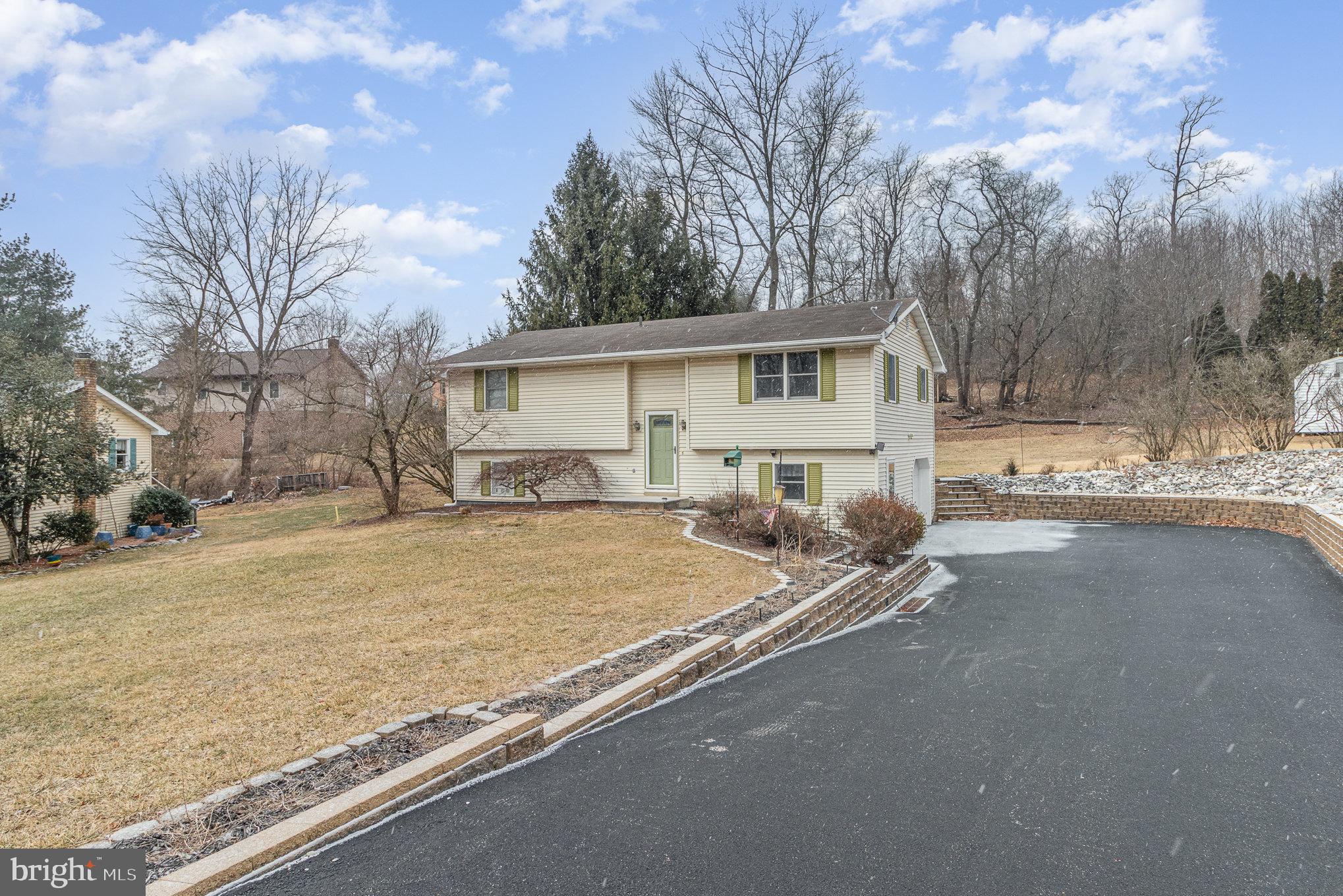 15 Penn Circle Hanover, PA 17331 - Photo 2 of 32 a view of a house with a yard covered in snow
