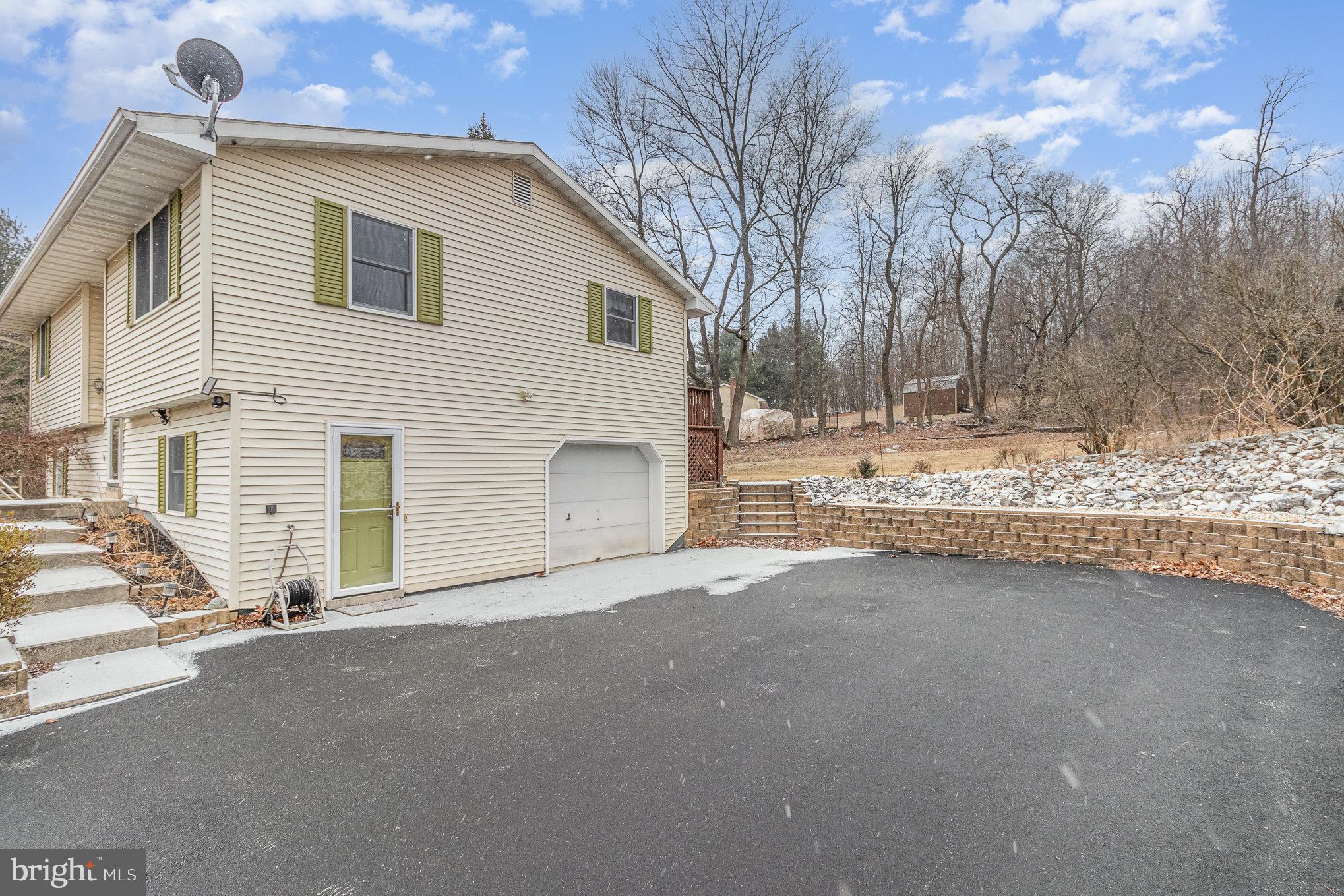 15 Penn Circle Hanover, PA 17331 - Photo 24 of 32 a view of a house with a yard and covered with snow