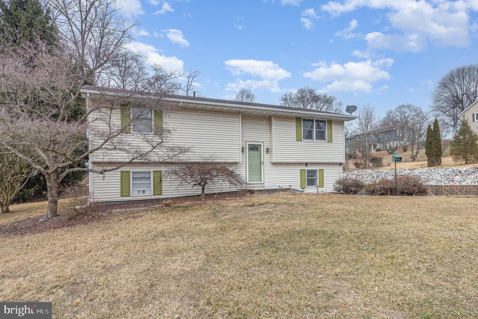 15 Penn Circle Hanover, PA 17331 - Photo 3 of 32 a front view of a house with a yard and garage