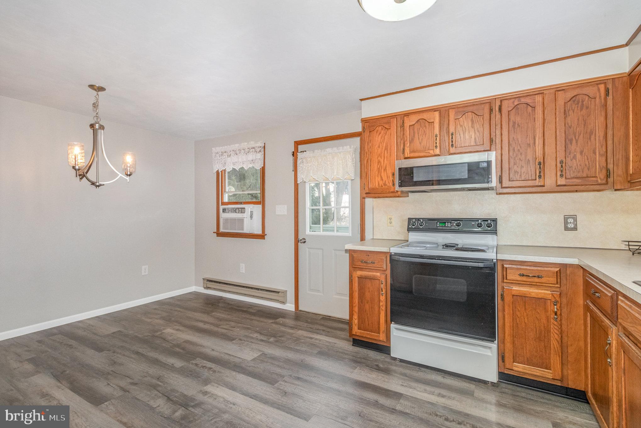 15 Penn Circle Hanover, PA 17331 - Photo 7 of 32 a kitchen with stainless steel appliances granite countertop a stove a sink and a refrigerator