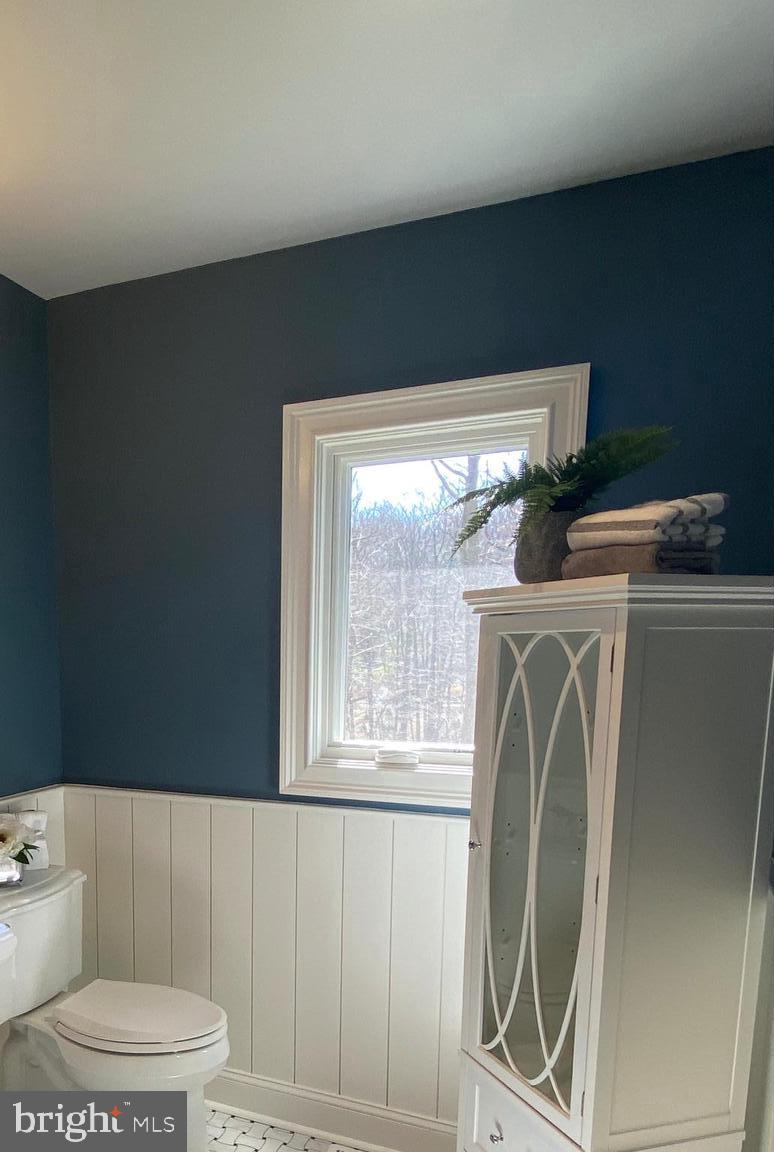 35 Dunminning Road Newtown Square, PA 19073 - Photo 31 of 37 half paneled walls in the hall bath