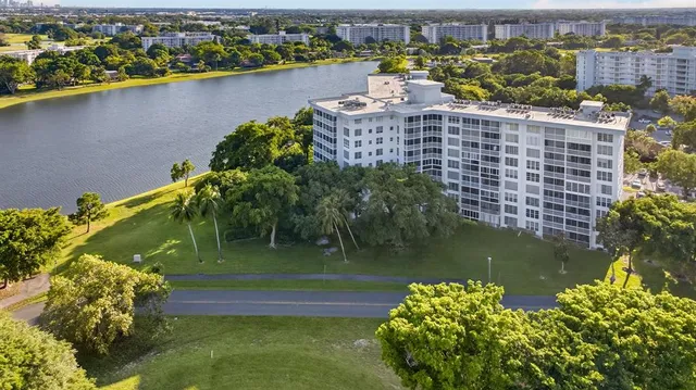 a view of a lake with a building in the background