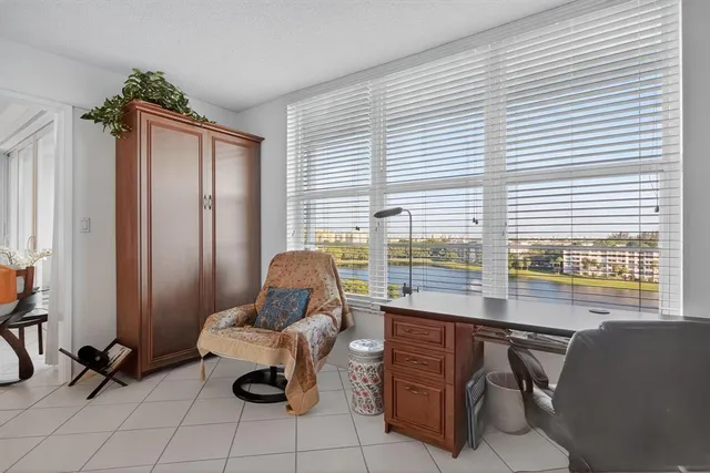 a work room with furniture and windows