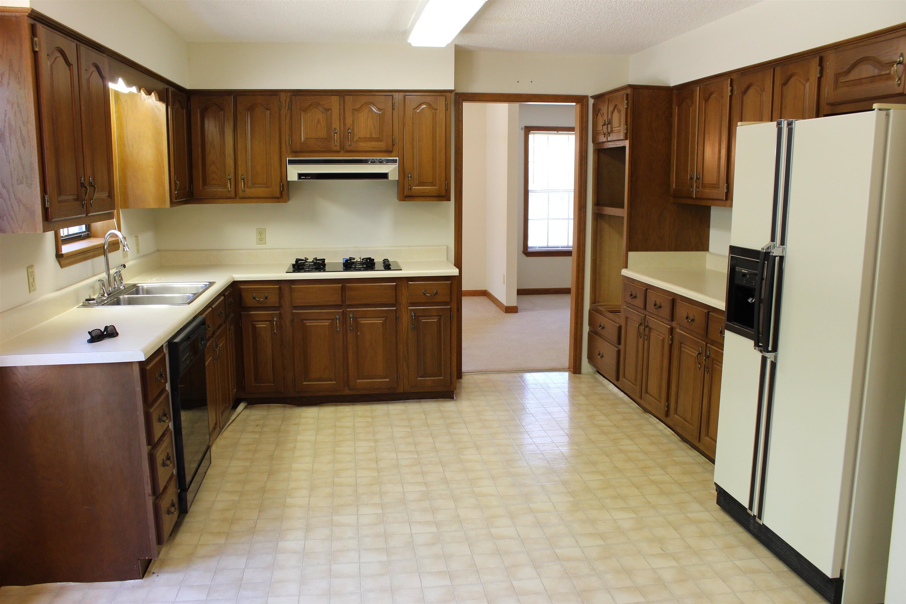 3360 Ebenezer Road Toone, TN 38381 - Photo 8 of 40 a kitchen with a refrigerator and a sink