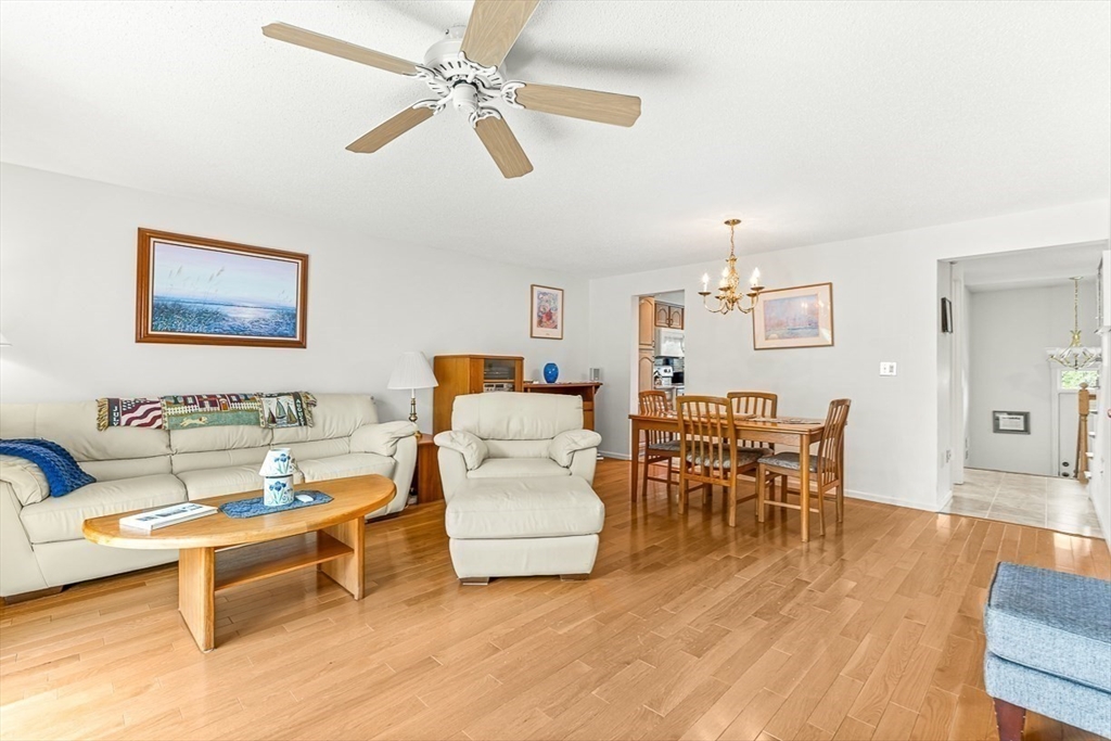 112 Abington Road, Unit 112 Danvers, MA 01923 - Photo 11 of 38 a living room with furniture and a wooden floor