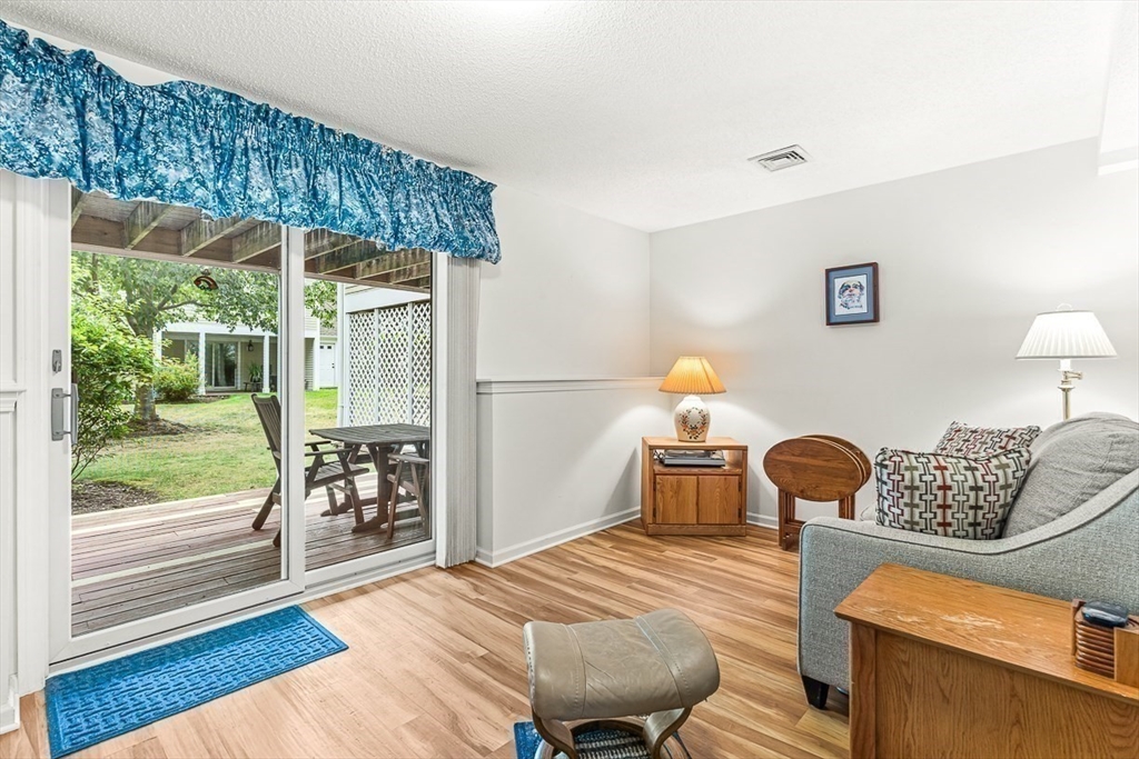 112 Abington Road, Unit 112 Danvers, MA 01923 - Photo 12 of 38 a bedroom with a bed and wooden floor
