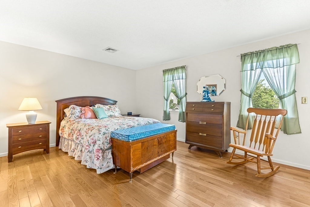 112 Abington Road, Unit 112 Danvers, MA 01923 - Photo 18 of 38 a bedroom with a bed and a window