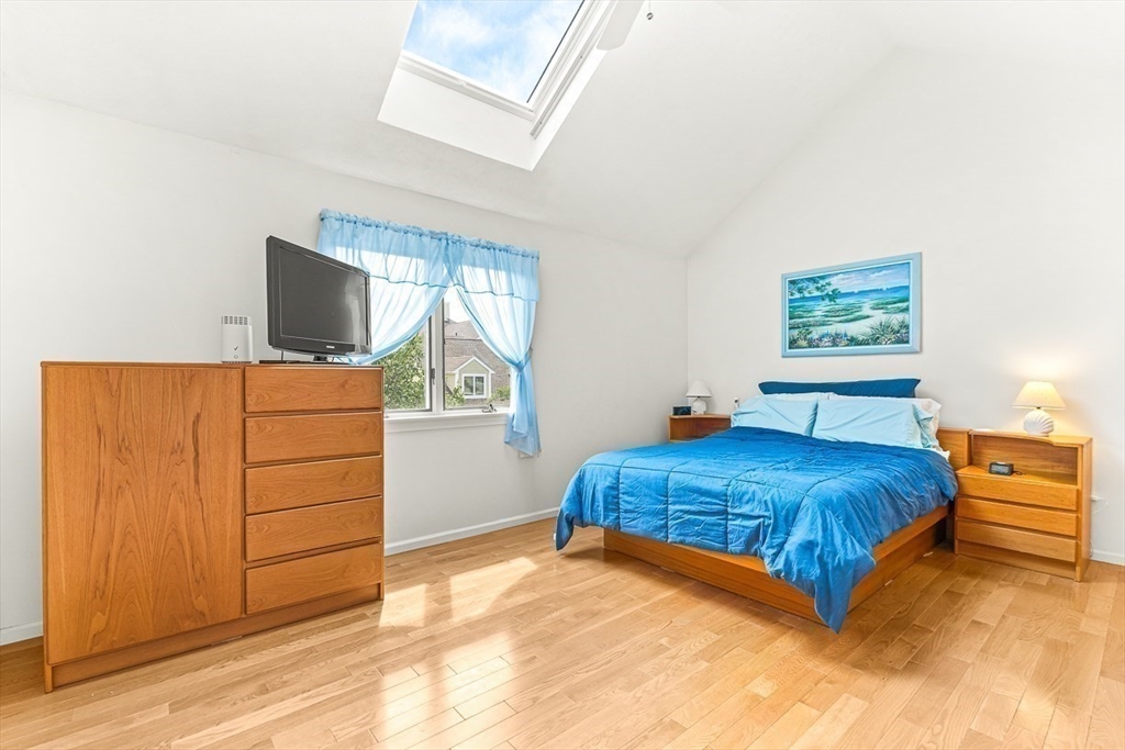 112 Abington Road, Unit 112 Danvers, MA 01923 - Photo 19 of 38 a living room with a bed and furniture