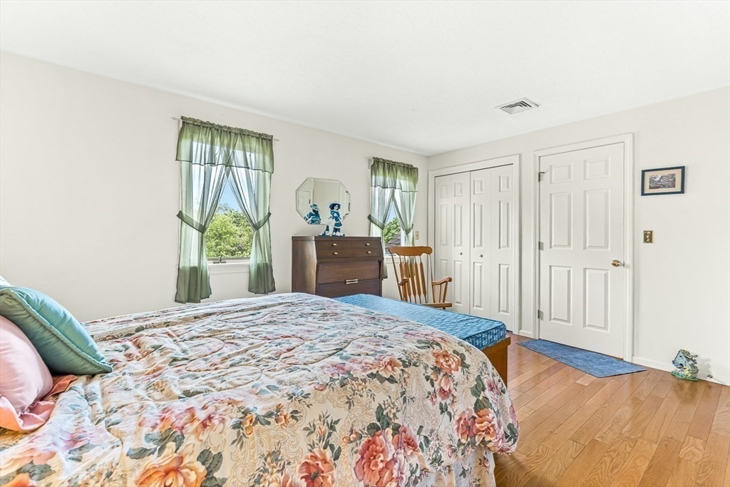 112 Abington Road, Unit 112 Danvers, MA 01923 - Photo 20 of 38 a bedroom with a bed and a window