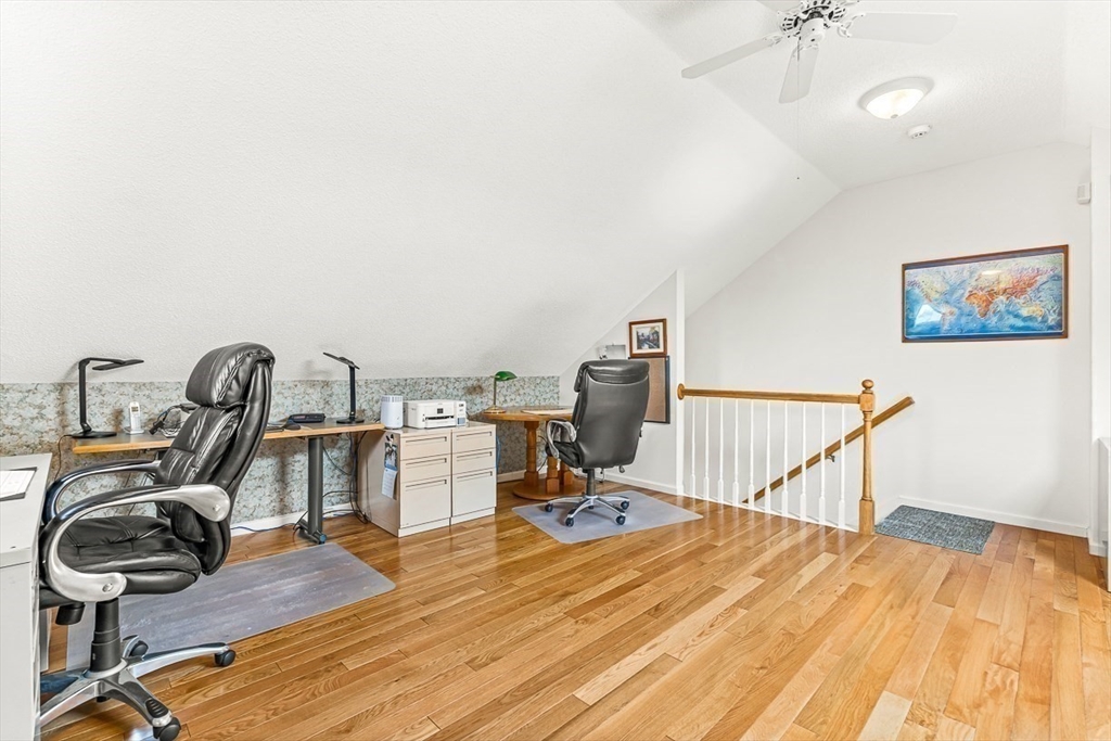112 Abington Road, Unit 112 Danvers, MA 01923 - Photo 21 of 38 a view of a workspace with furniture and wooden floor