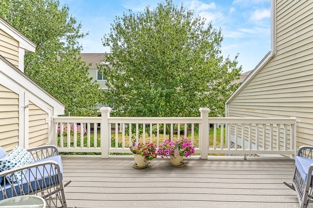 112 Abington Road, Unit 112 Danvers, MA 01923 - Photo 26 of 38 a view of a chair and tables