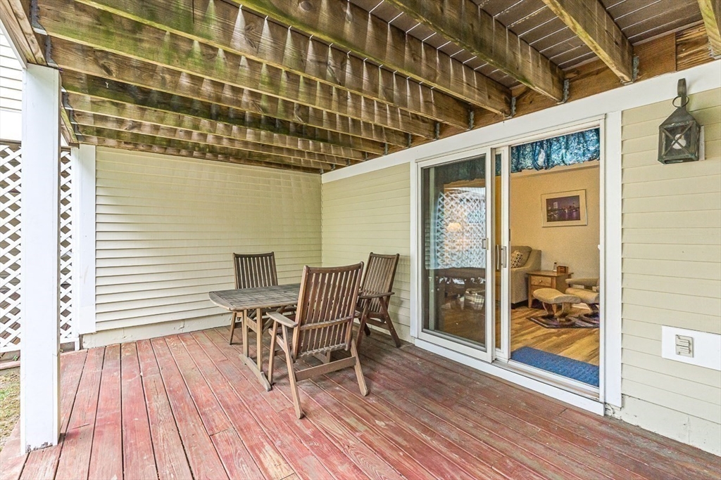 112 Abington Road, Unit 112 Danvers, MA 01923 - Photo 27 of 38 a view of a balcony with dining area