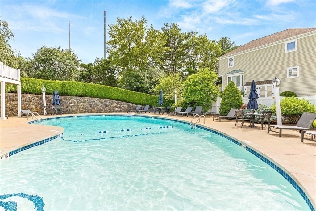 112 Abington Road, Unit 112 Danvers, MA 01923 - Photo 33 of 38 a view of a swimming pool with a patio