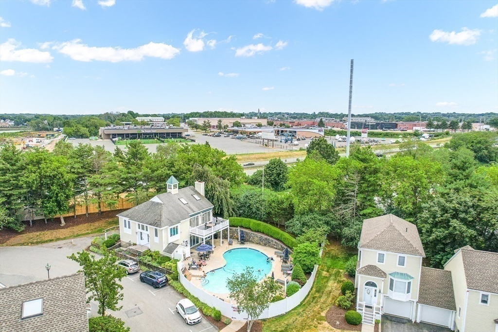 112 Abington Road, Unit 112 Danvers, MA 01923 - Photo 34 of 38 a aerial view of a house with a yard and lake view