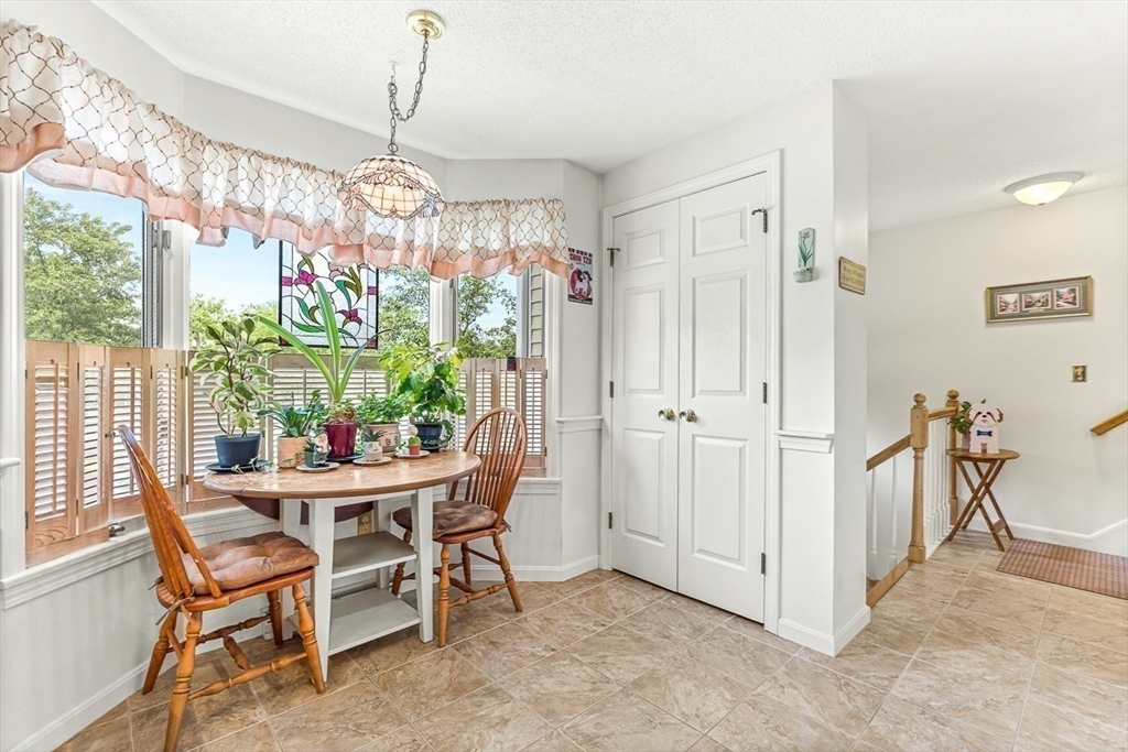 112 Abington Road, Unit 112 Danvers, MA 01923 - Photo 7 of 38 a view of a dining room with furniture window and outside view