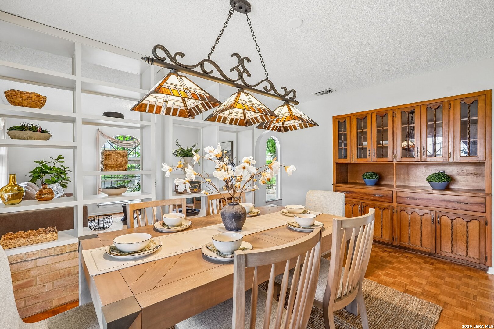 20632 Timber Rose Drive Garden Ridge, TX 78266 - Photo 15 of 46 a view of a dining room and livingroom with furniture wooden floor a chandelier