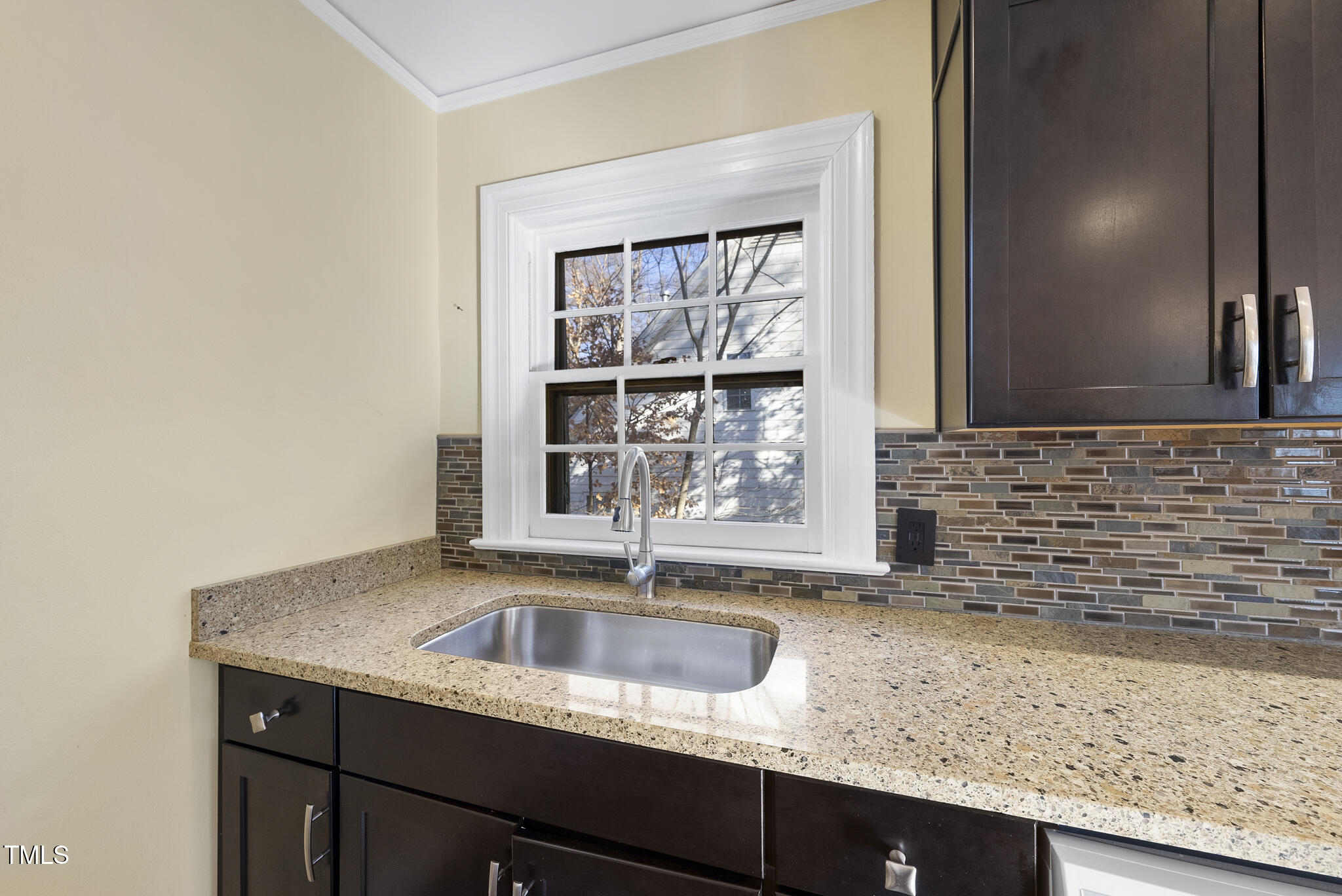 23 Shepherd Street Raleigh, NC 27607 - Photo 19 of 36 a kitchen with granite countertop sink and window
